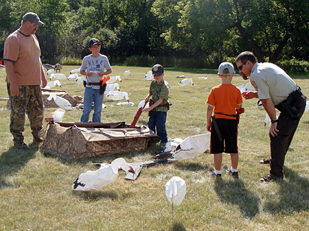Young wardens check the spread Image